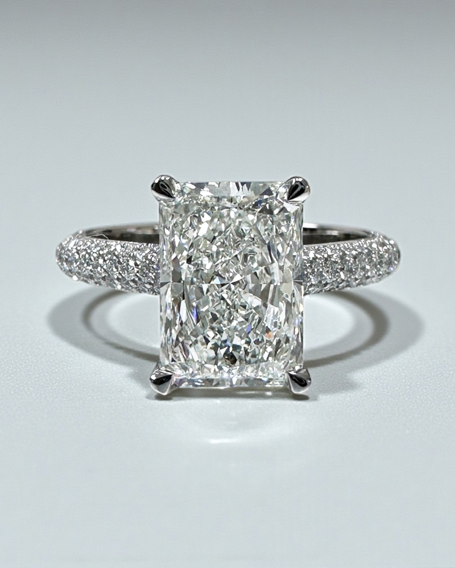 3ct radiant cut lab grown diamond set in a three row diamond band 3D cathedral style with hidden halo, platinum or 18kt yellow gold