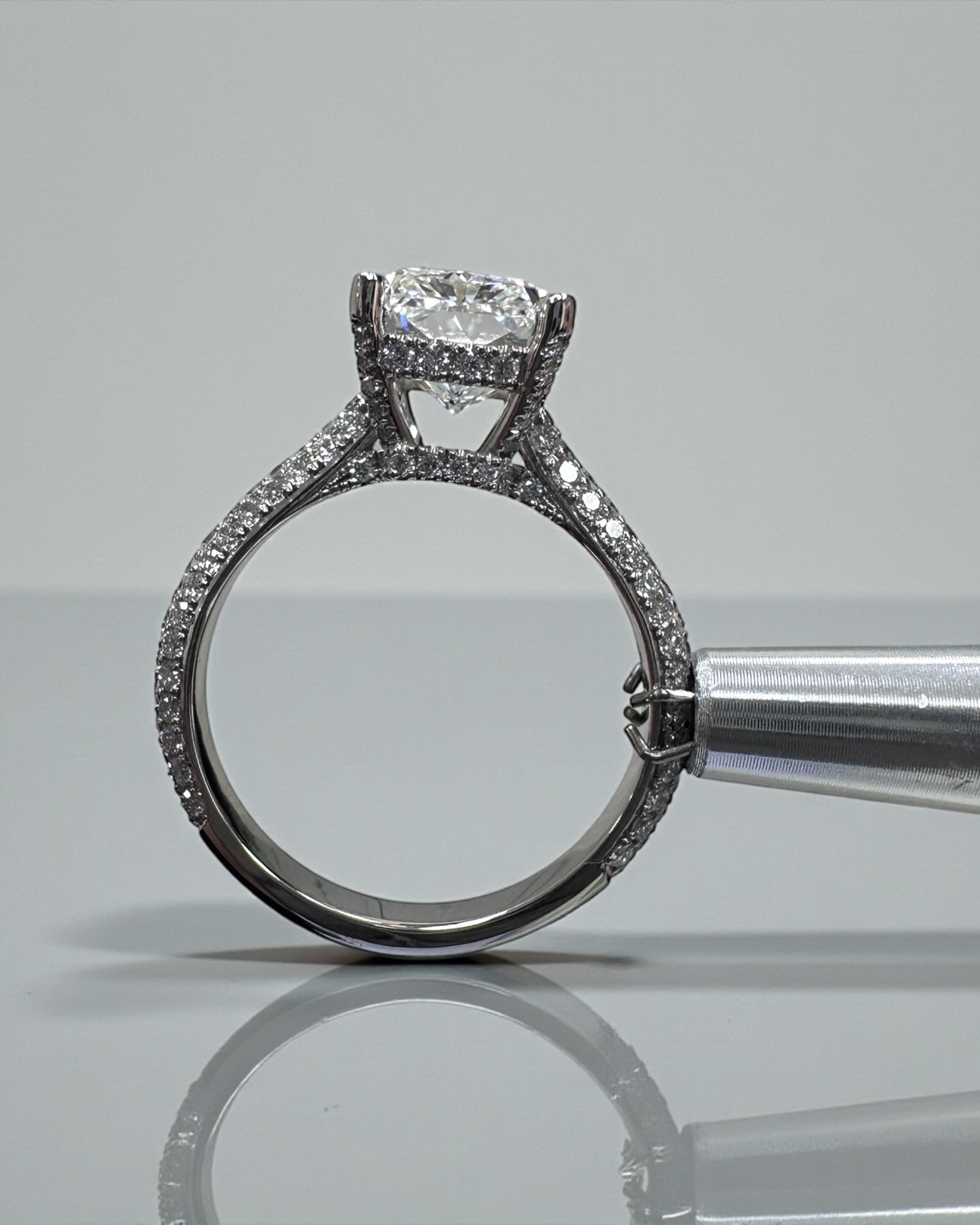 3ct radiant cut lab grown diamond set in a three row diamond band 3D cathedral style with hidden halo, platinum or 18kt yellow gold