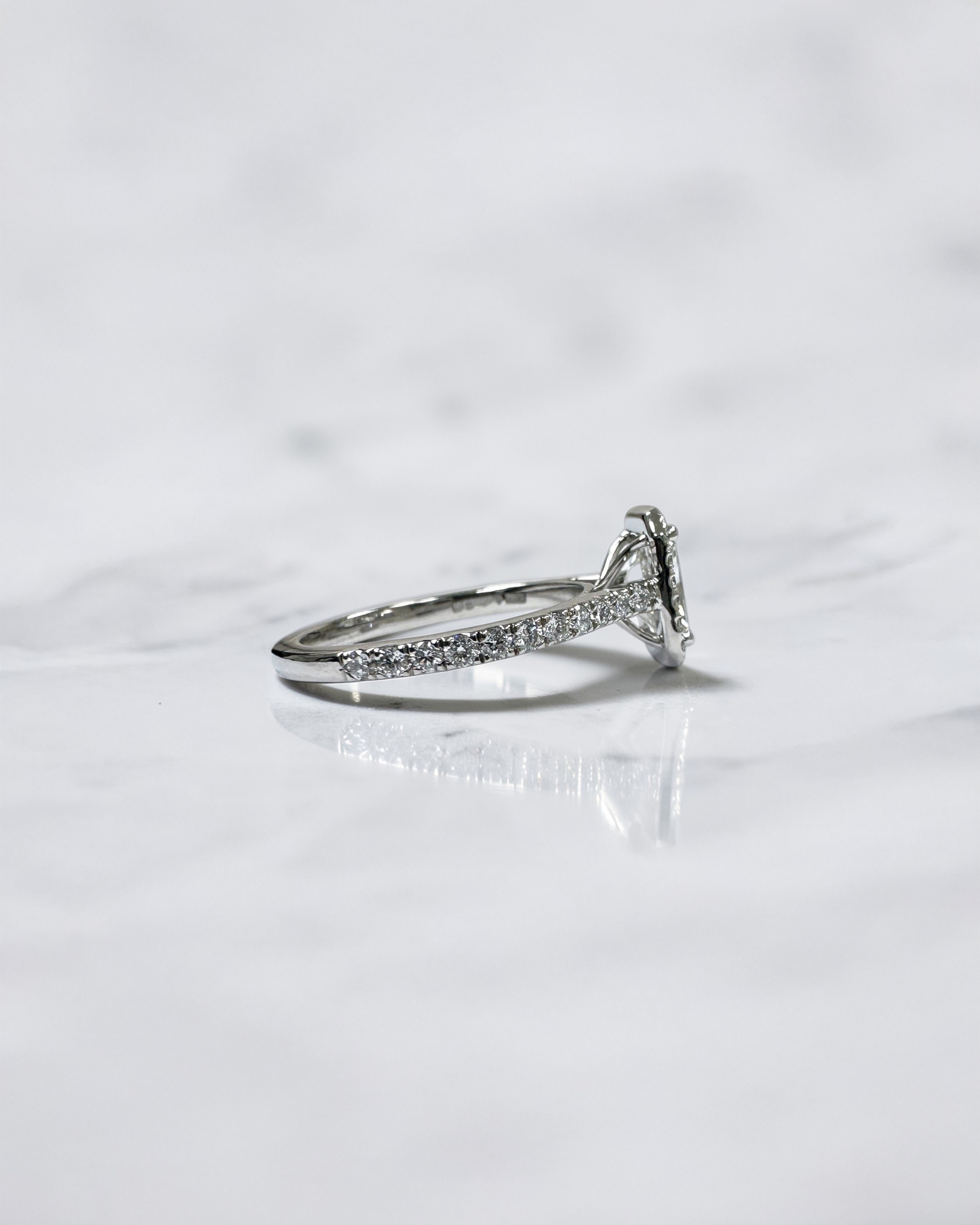 Lab grown 0.70ct radiant cut diamond halo engagement ring with seamless halo and diamond shoulders in white gold or platinum cathedral setting