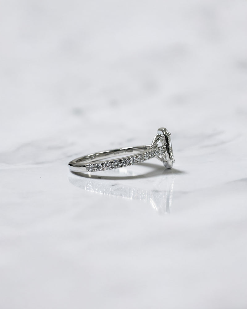 Lab grown 0.70ct radiant cut diamond halo engagement ring with seamless halo and diamond shoulders in white gold or platinum cathedral setting