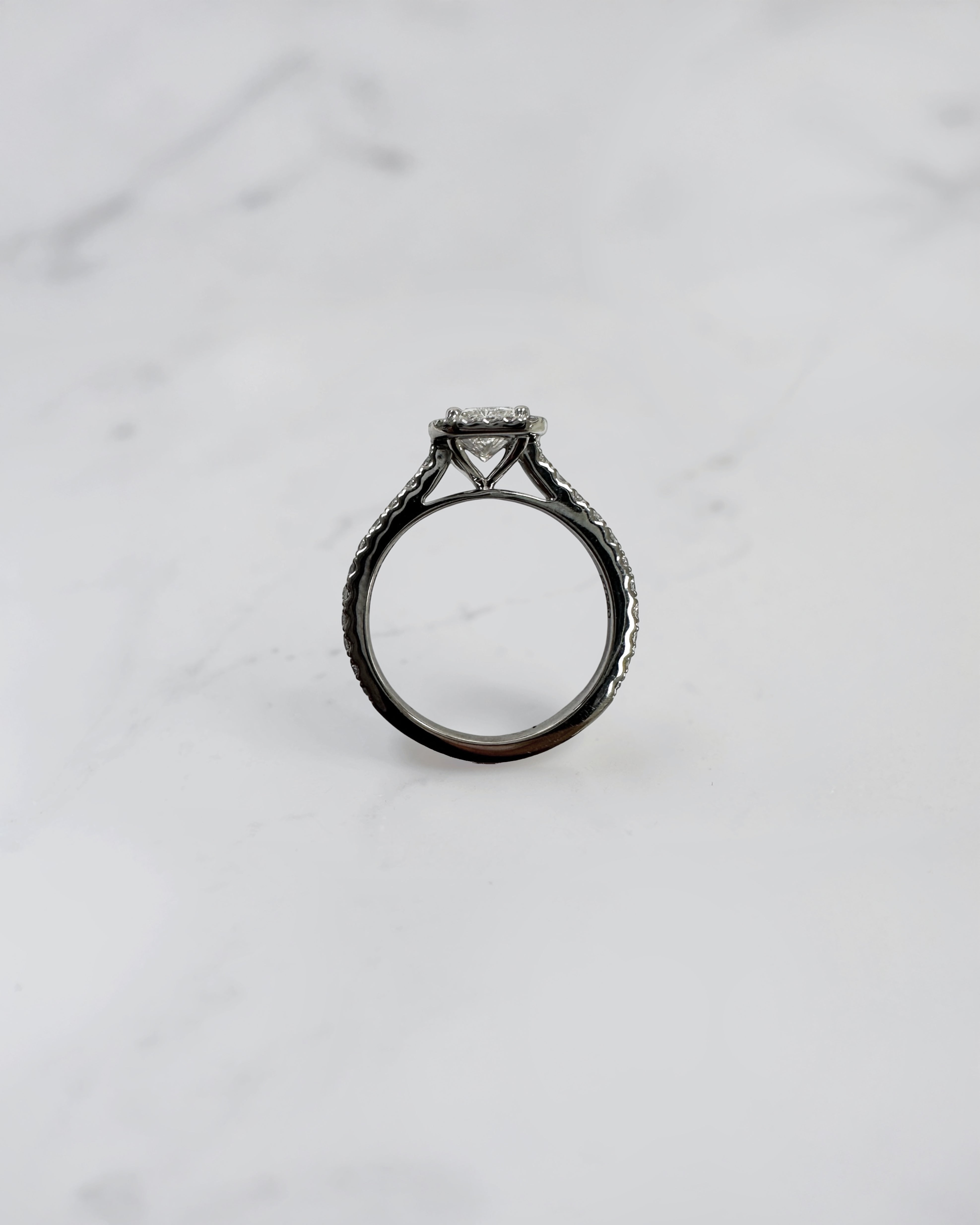 Lab grown 0.70ct radiant cut diamond halo engagement ring with seamless halo and diamond shoulders in white gold or platinum cathedral setting