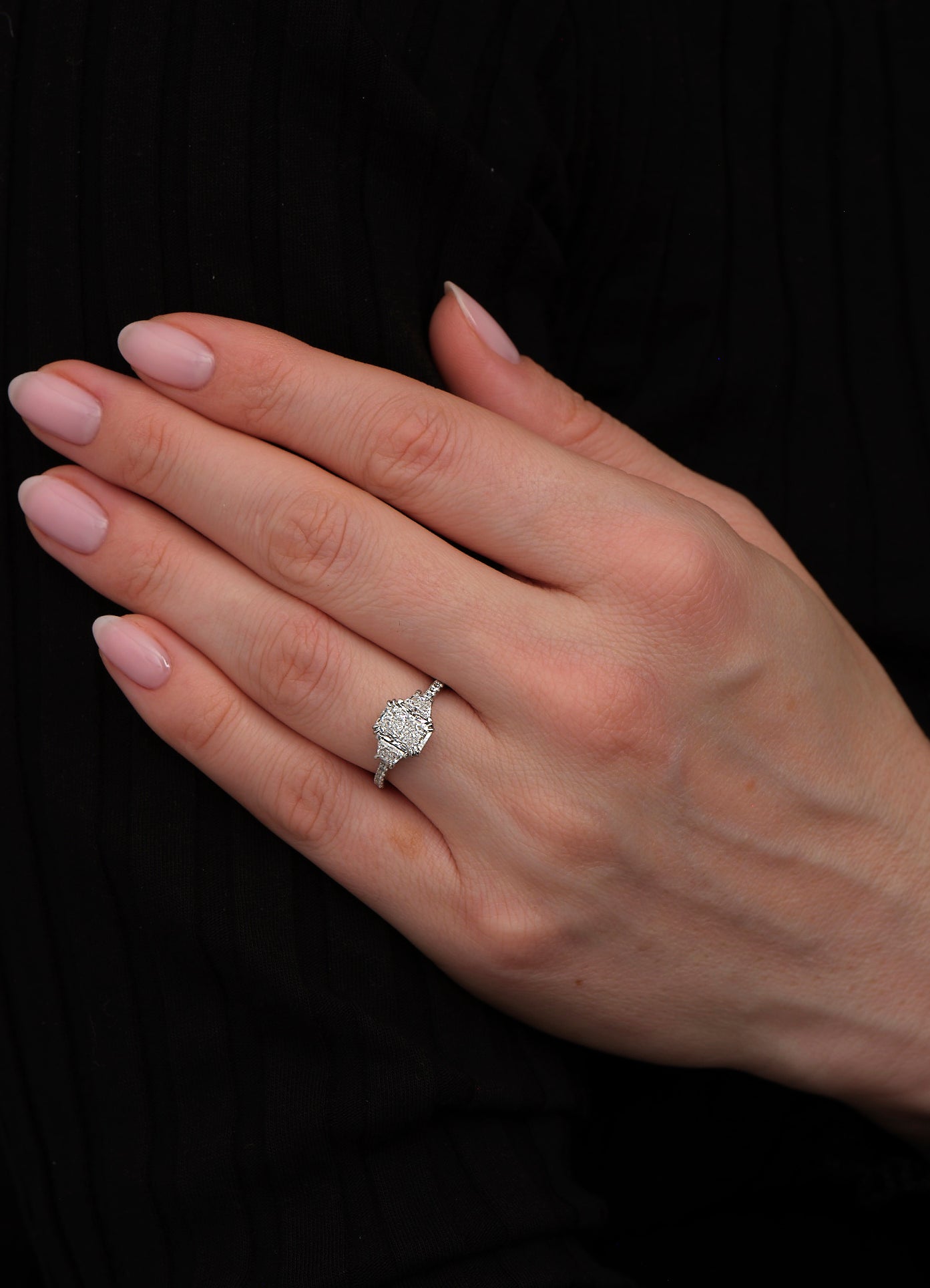 radiant cut trapezoids trilogy engagement ring