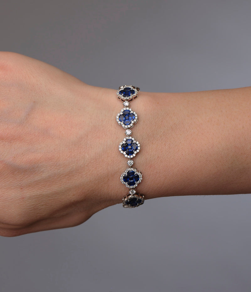 Diamond & Blue Sapphire Clover Bracelet 18kt white gold featuring 3.50ct F VS2+ diamonds and 10ct blue sapphires, handcrafted luxury jewellery by Layla Diamonds London on hand, wrist, arm