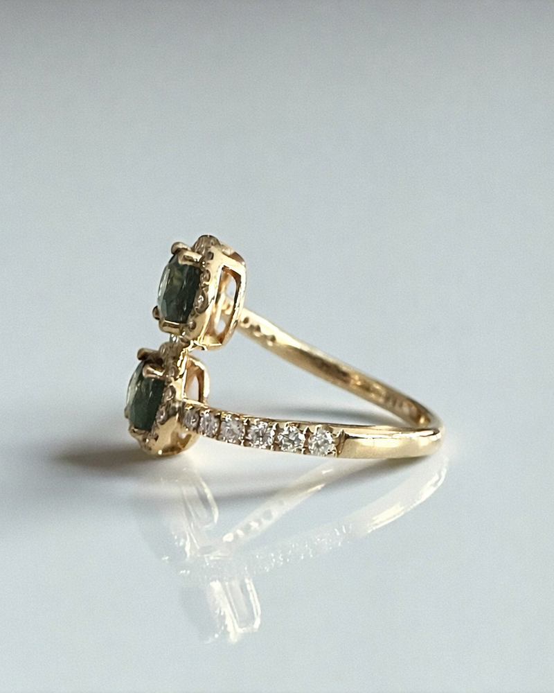 Natural teal sapphire two stone diamond halo ring in 18kt yellow gold