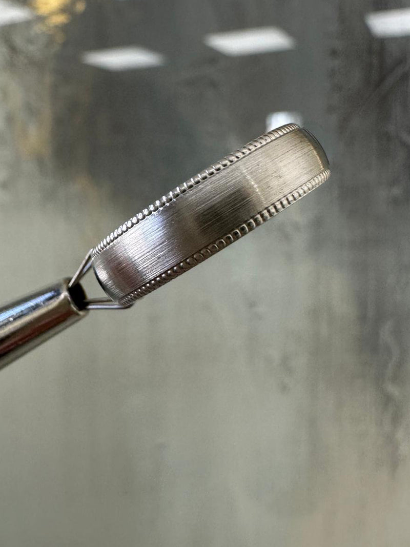 A classic 5mm court milgrain edge brushed ring from our wedding band for him collection.