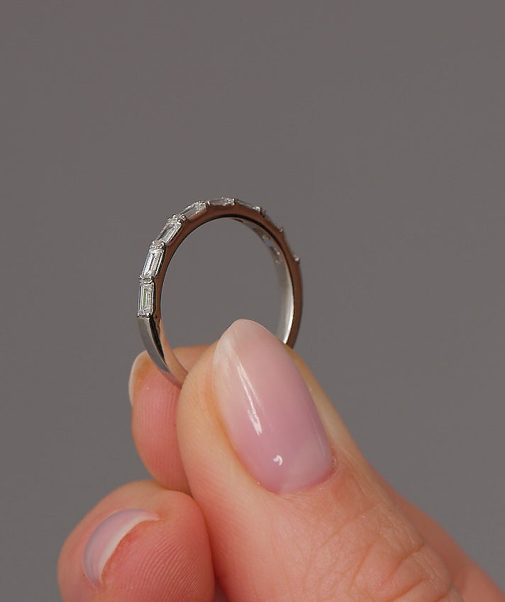 0.60ct baguette eternity band worn on a finger, showcasing a classic wedding bands for women design.