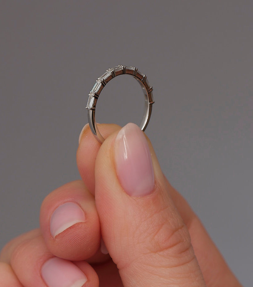 Side profile of a baguette cut diamond eternity ring, part of our wedding bands for women range.