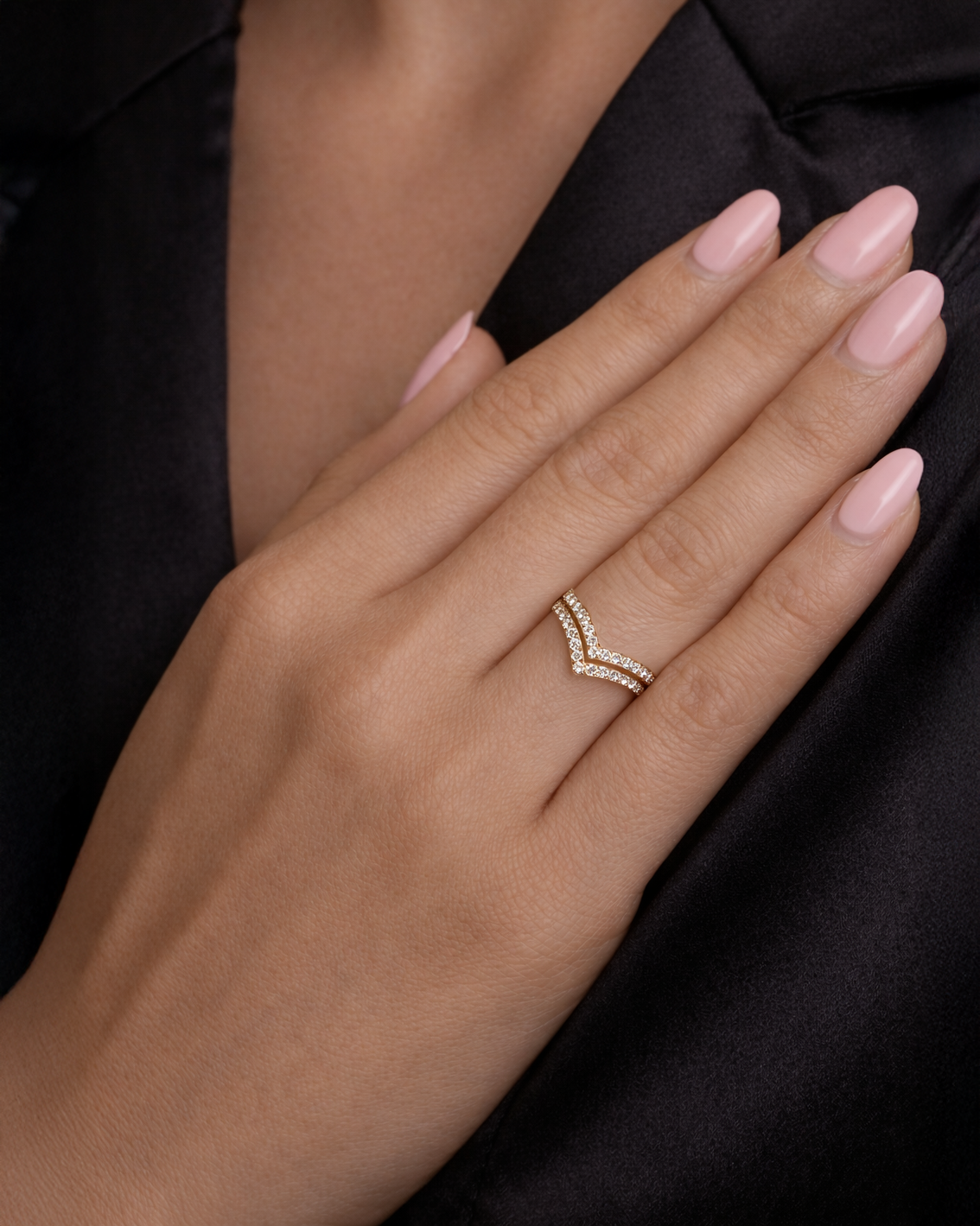 Double row wishbone diamond ring with pavé set diamonds, front view showing V shaped wishbone design. 9kt or 18kt yellow or white gold on hand