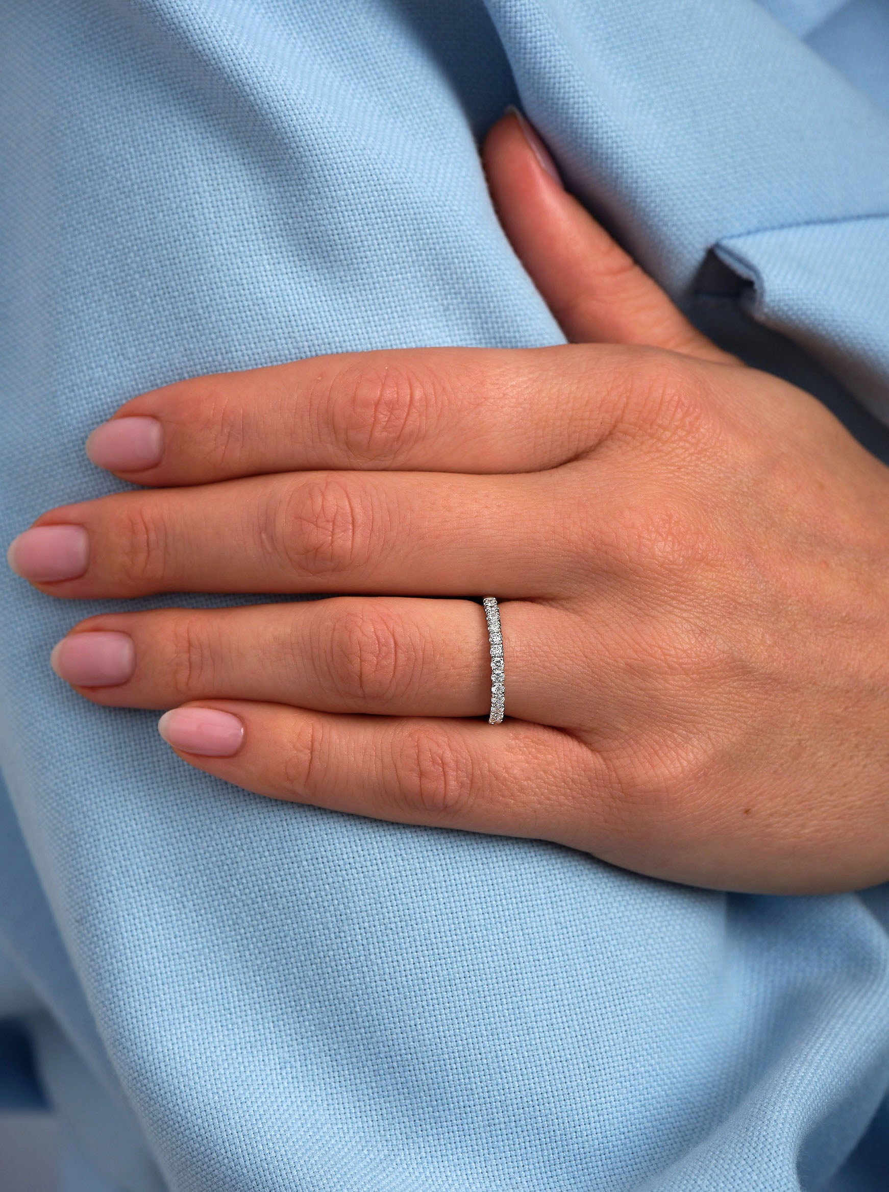 A 2mm half eternity women's diamond engagement band in white gold.