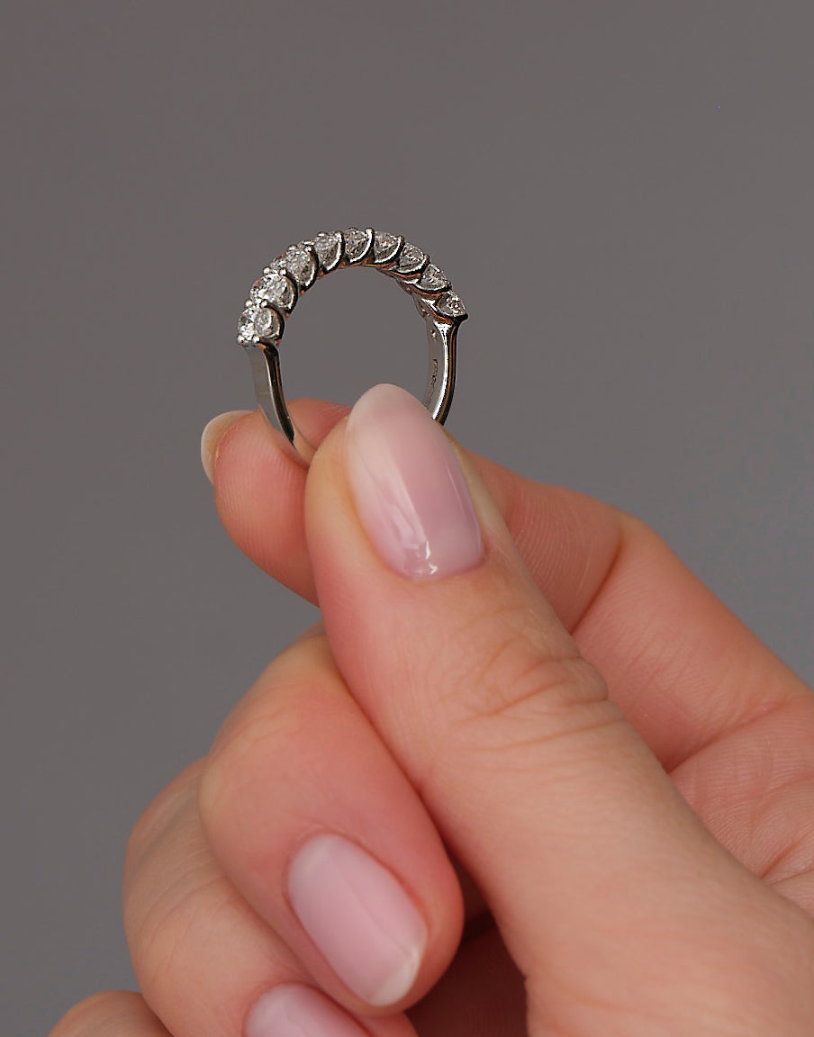 Side profile of a midi oval diamond band, part of our women’s diamond engagement band range.