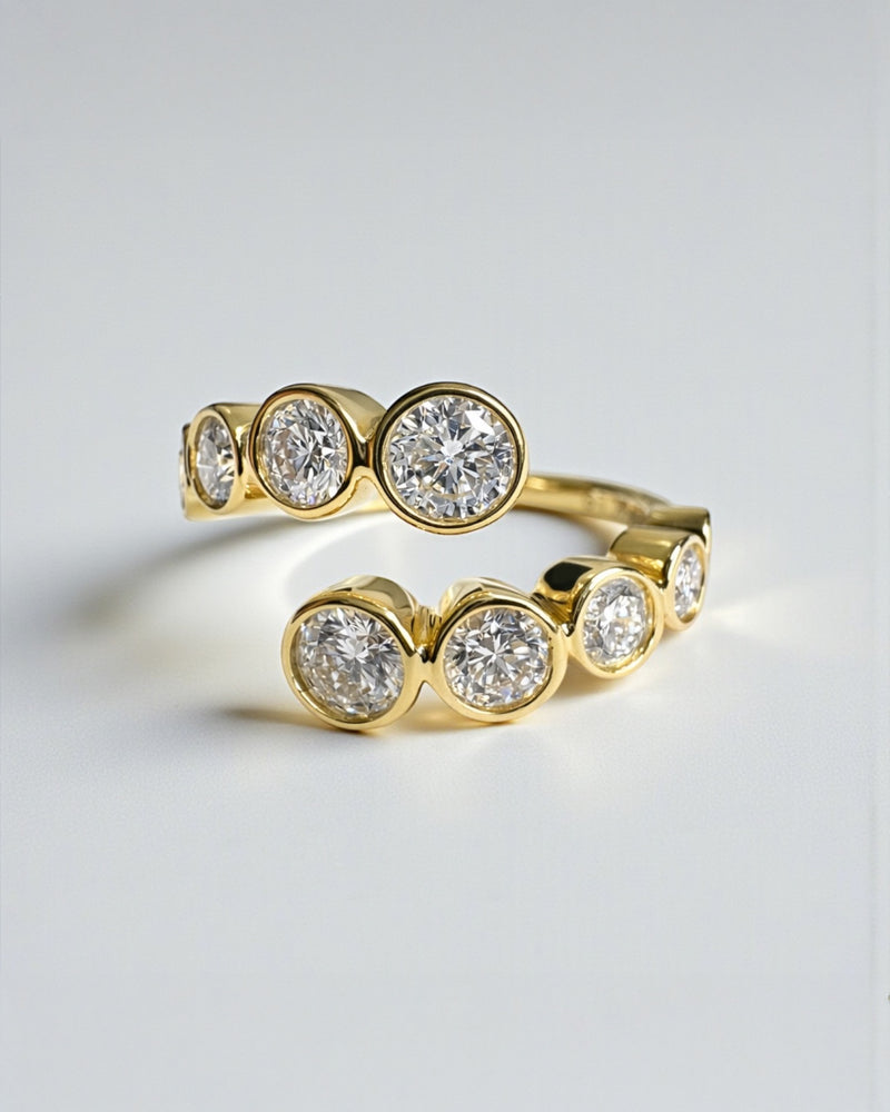 Bezel set diamond bubble wrap ring with round brilliant diamonds in yellow gold