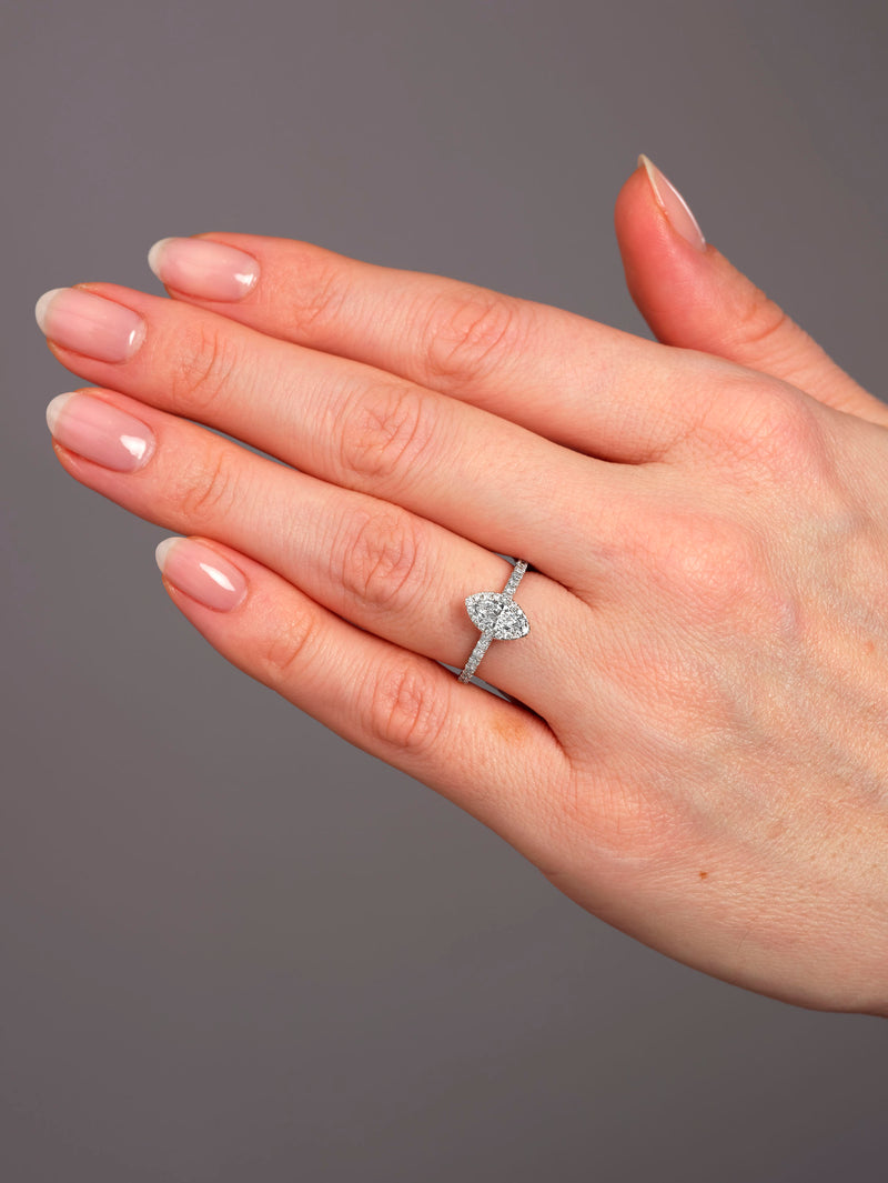 Close-up of a 0.35ct cushion cut diamond in a marquise engagement ring diamond style setting.