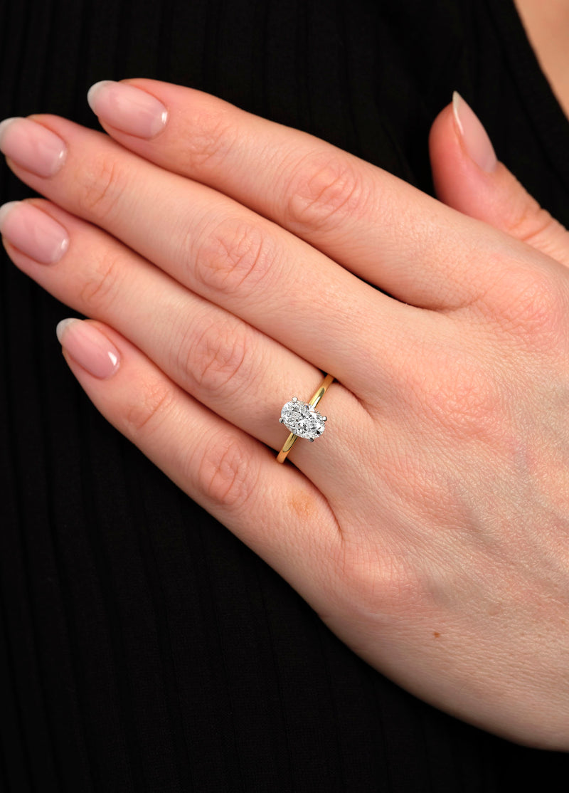 1.50ct oval cut lab grown diamond hidden halo solitaire engagement ring with platinum head by Layla Diamonds.
