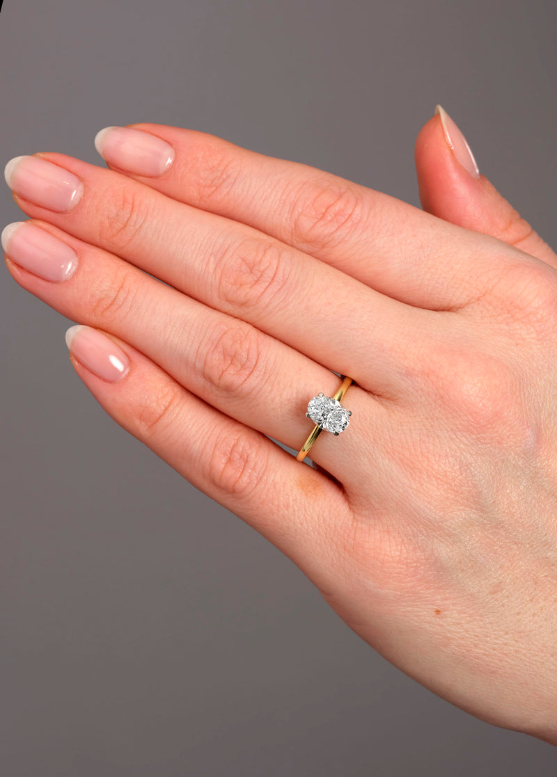 1.50ct oval cut lab grown diamond hidden halo solitaire engagement ring with platinum head by Layla Diamonds.