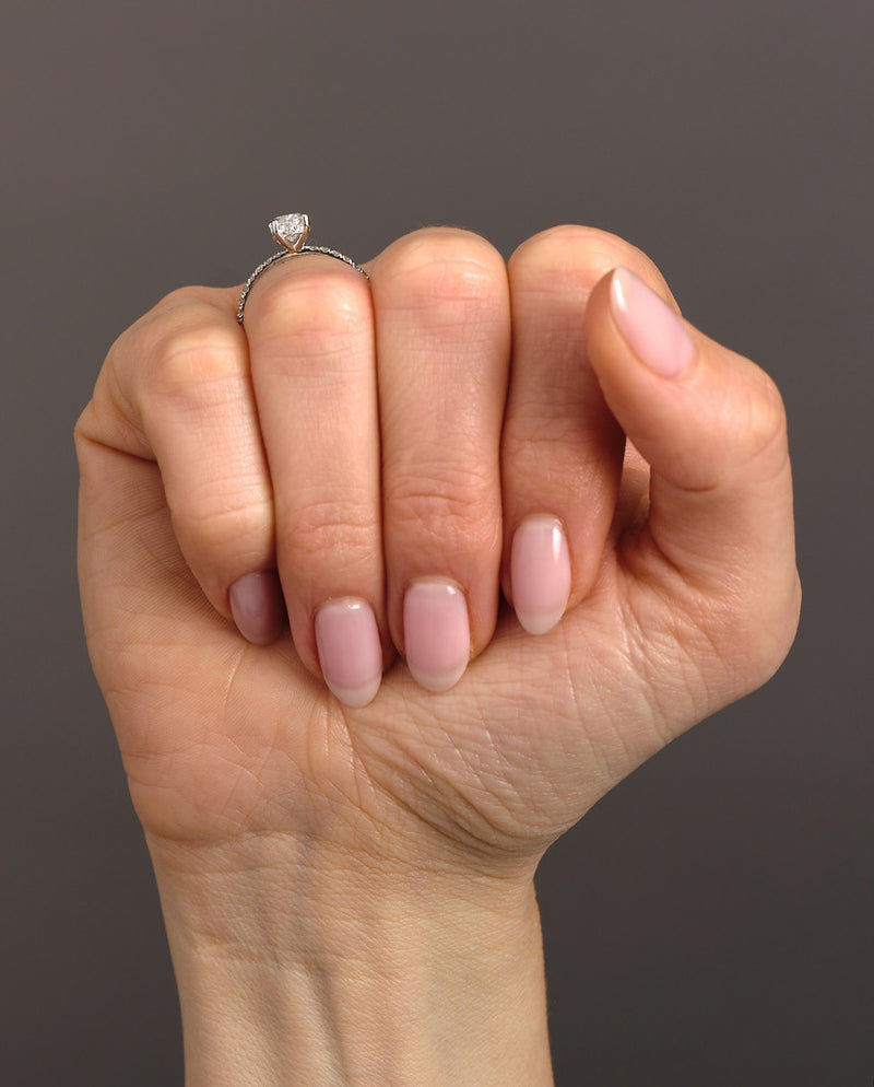 1ct oval cut lab grown diamond hidden halo engagement ring with diamond shoulders by Layla Diamonds