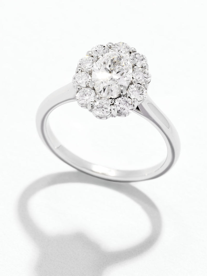 0.70ct Oval Flower Halo Lab Grown Diamond Engagement Rings in London.