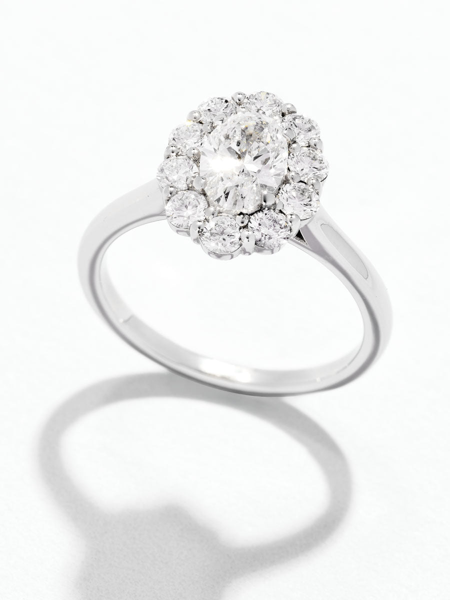 0.70ct Oval Flower Halo Lab Grown Diamond Engagement Rings in London.