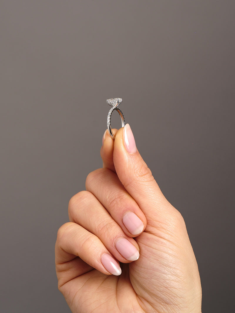 1.50ct oval cut lab grown diamond hidden halo engagement ring with diamond shoulders by Layla Diamonds.