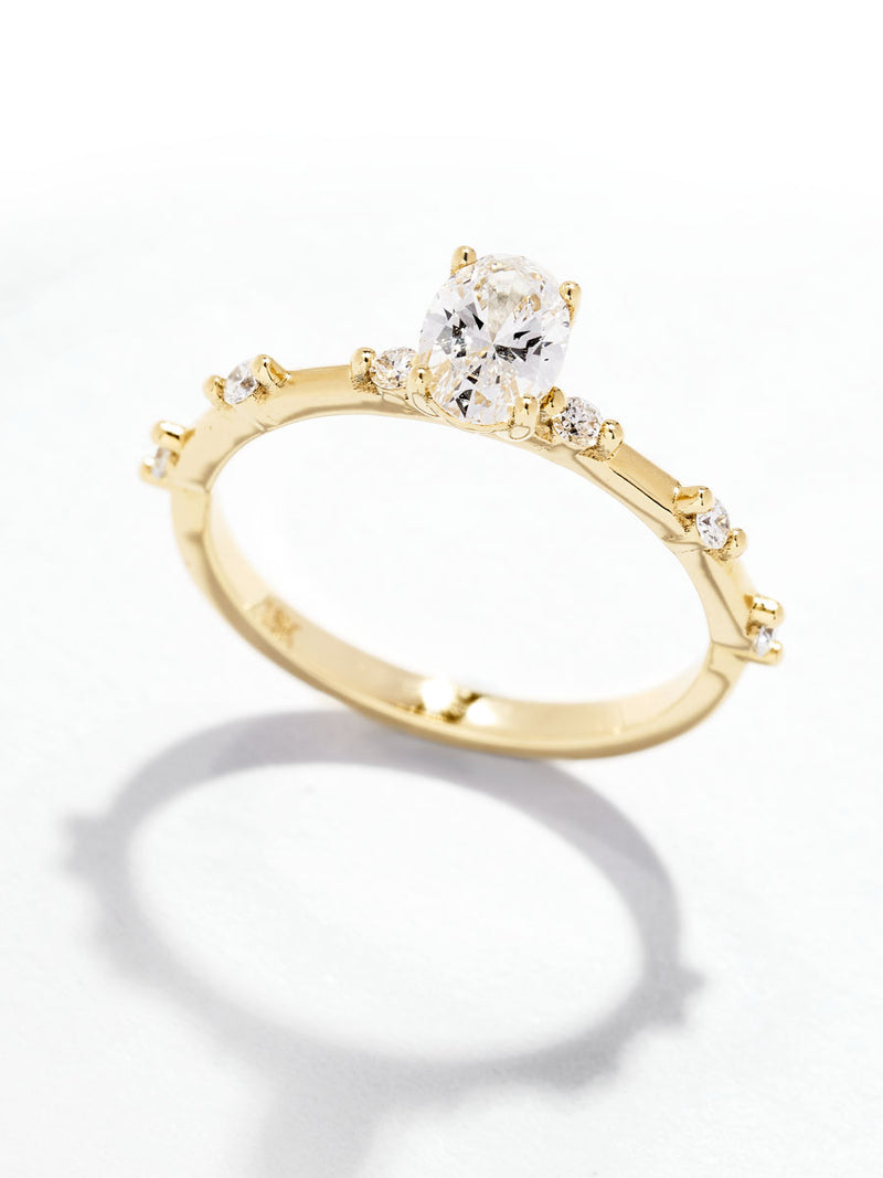 0.50ct oval cut lab grown diamond engagement ring with spaced bubble diamond band by Layla Diamonds.