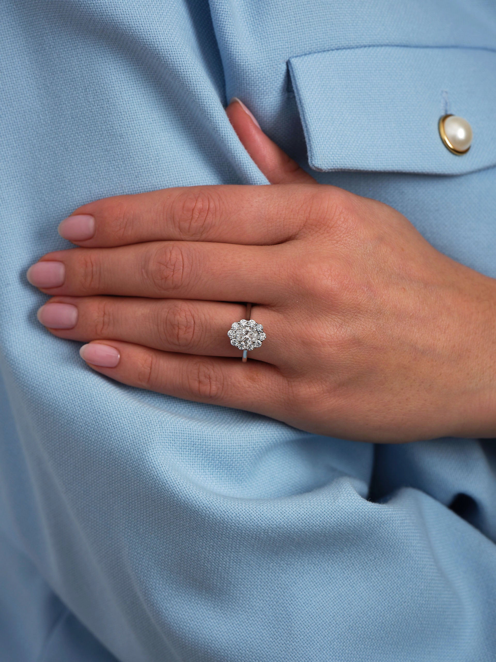 0.70ct Oval Flower Halo Lab Grown Diamond Engagement Rings in London.