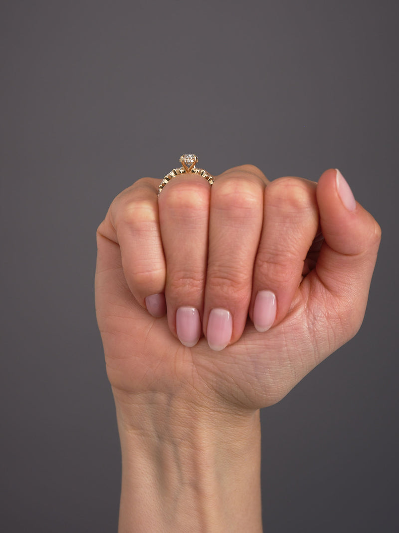 1.50ct oval cut lab grown diamond engagement ring with marquise and round diamond band and hidden halo by Layla Diamonds.