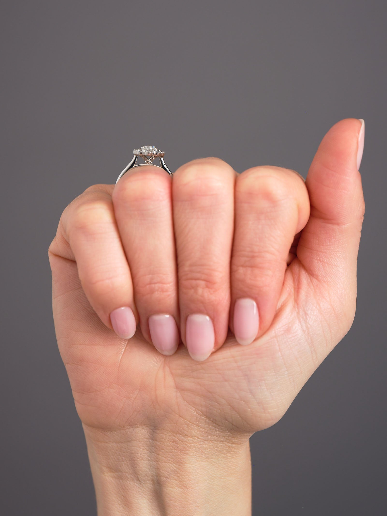 0.70ct Oval Flower Halo Lab Grown Diamond Engagement Rings in London.
