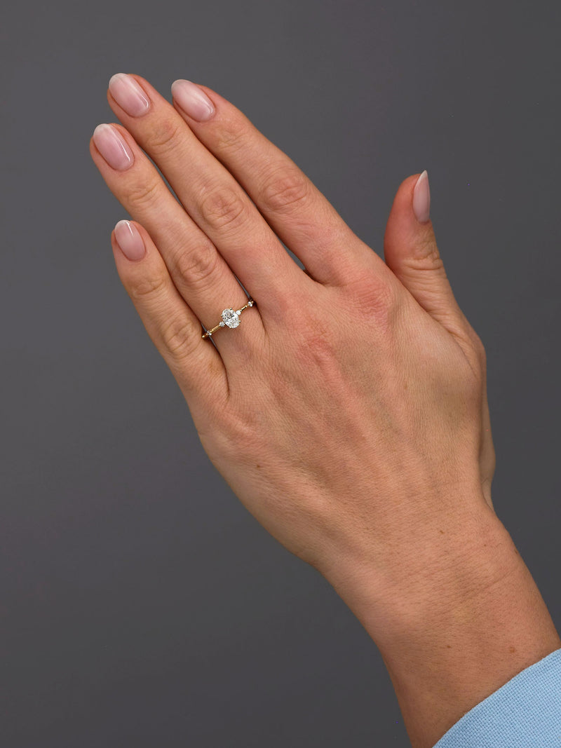 0.50ct oval cut lab grown diamond engagement ring with spaced bubble diamond band by Layla Diamonds.