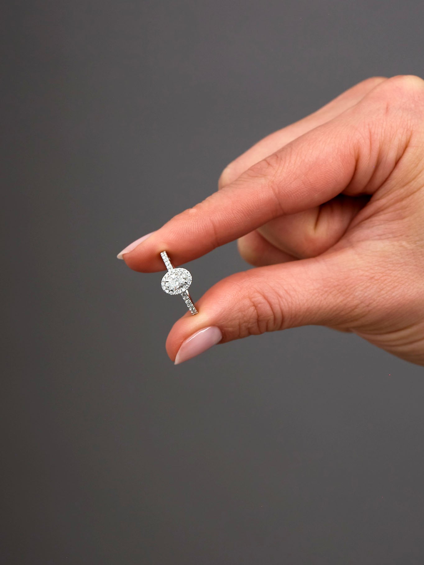 0.50ct Oval Seamless Halo Lab Grown Diamond Engagement Rings in London.