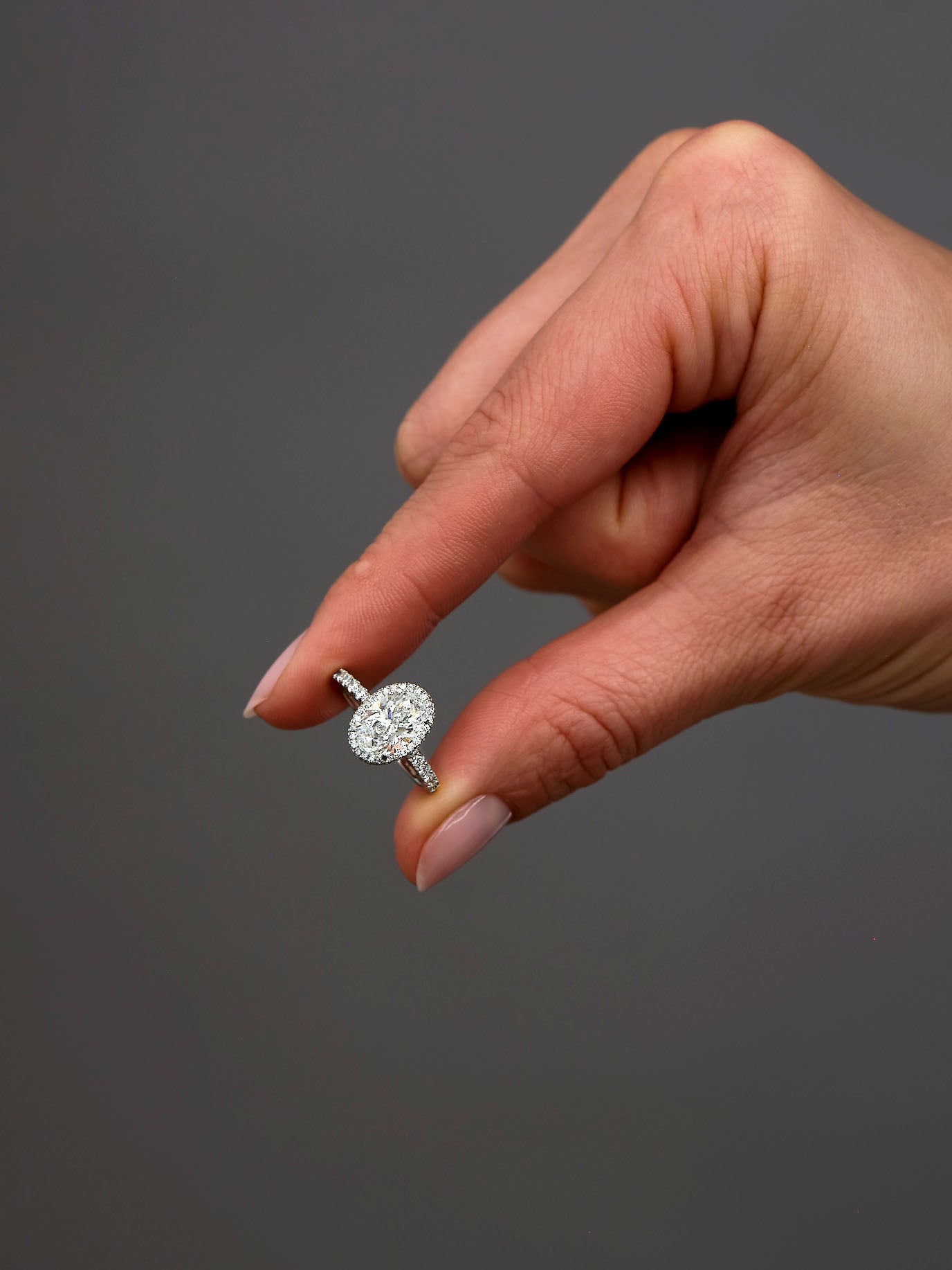2ct Oval Seamless 2D Halo Lab Grown Diamond Engagement Rings in London.