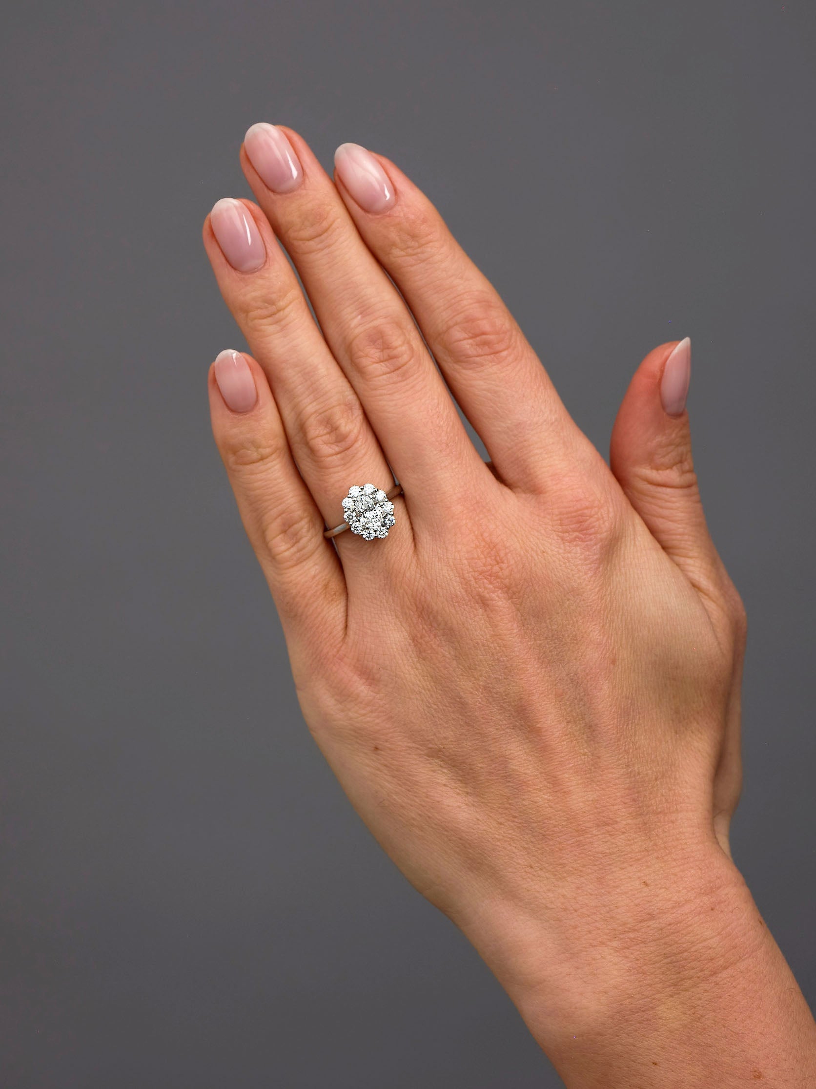 0.70ct Oval Flower Halo Lab Grown Diamond Engagement Rings in London.