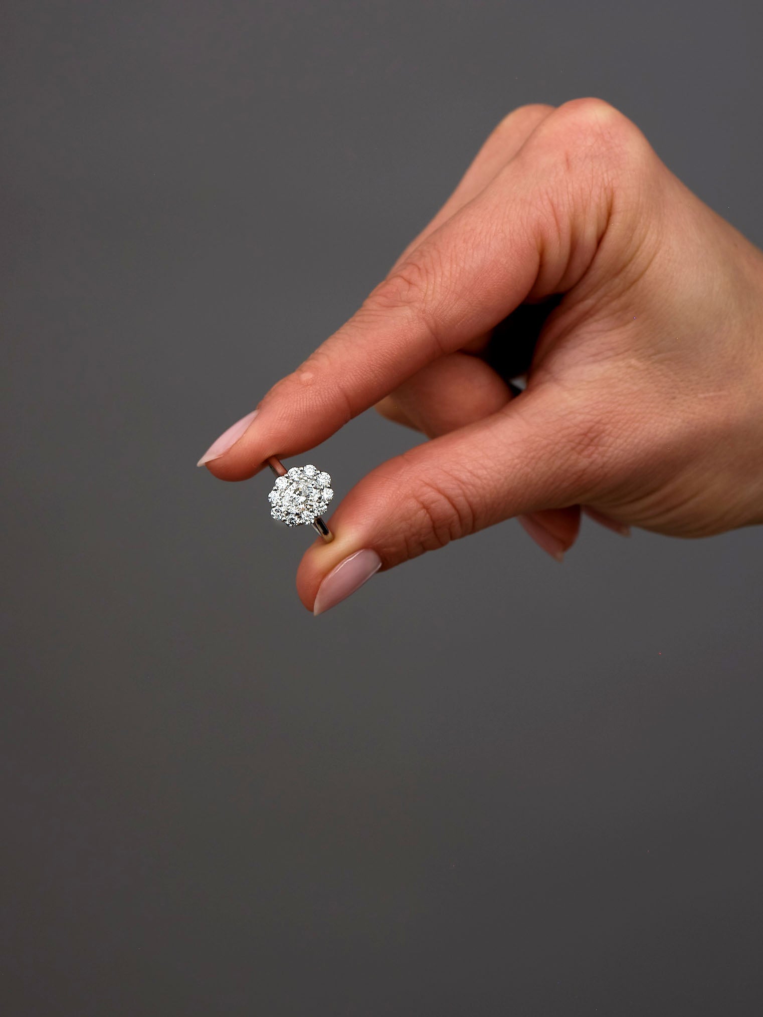0.70ct Oval Flower Halo Lab Grown Diamond Engagement Rings in London.