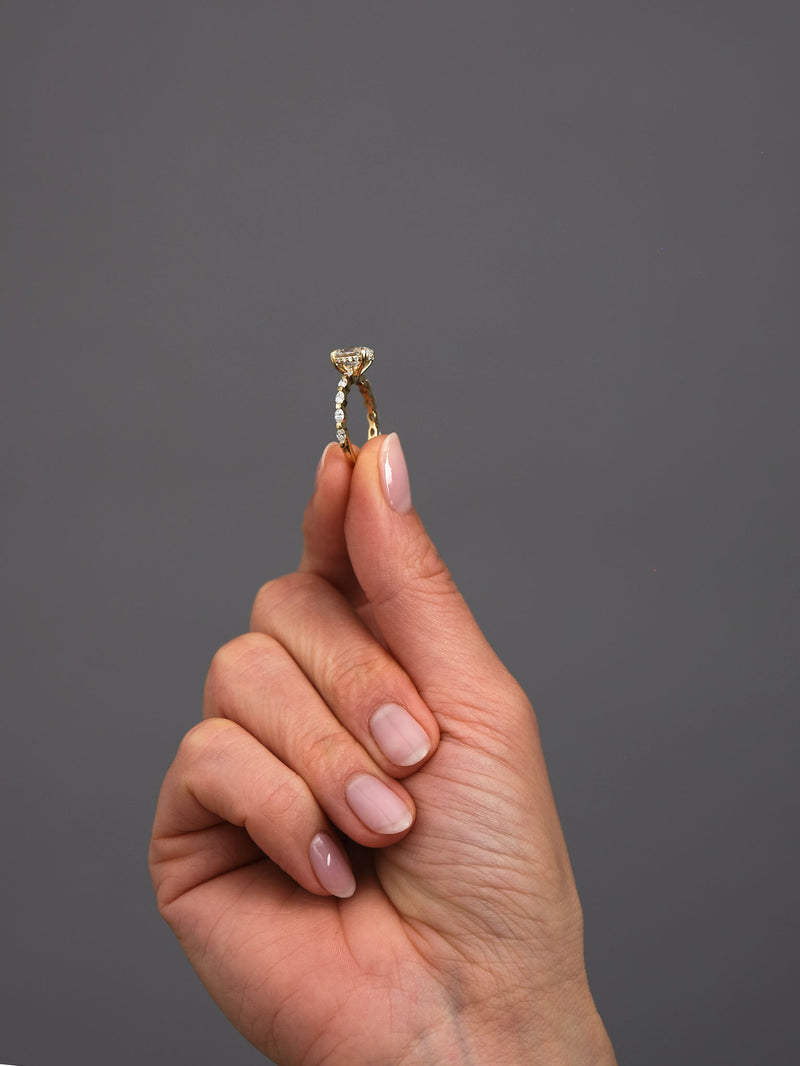 1.50ct oval cut lab grown diamond engagement ring with marquise and round diamond band and hidden halo by Layla Diamonds.