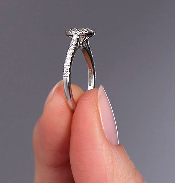 0.35ct oval cut lab grown diamond seamless halo engagement ring with diamond shoulders by Layla Diamonds.