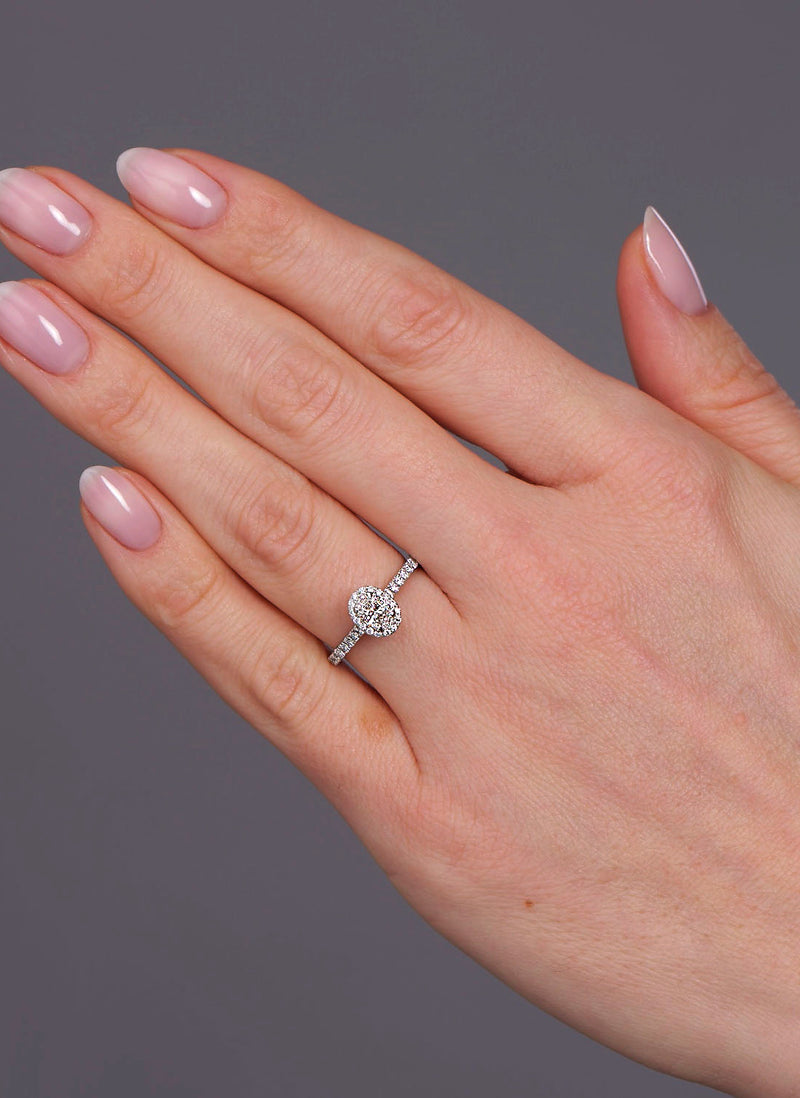 0.35ct oval cut lab grown diamond seamless halo engagement ring with diamond shoulders by Layla Diamonds.