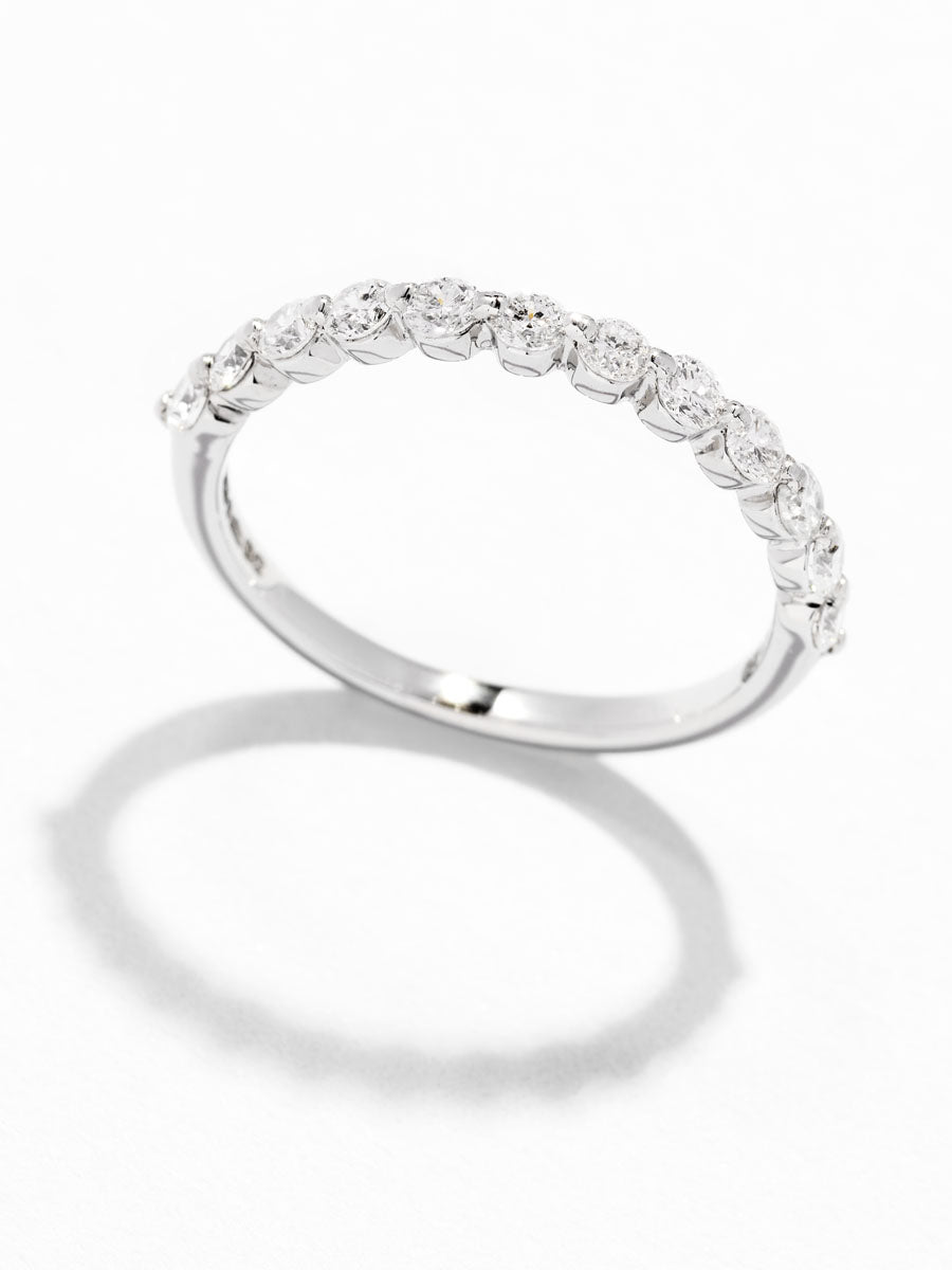 Close-up detail of the round diamonds in this elegant bubble style diamond rings for women.