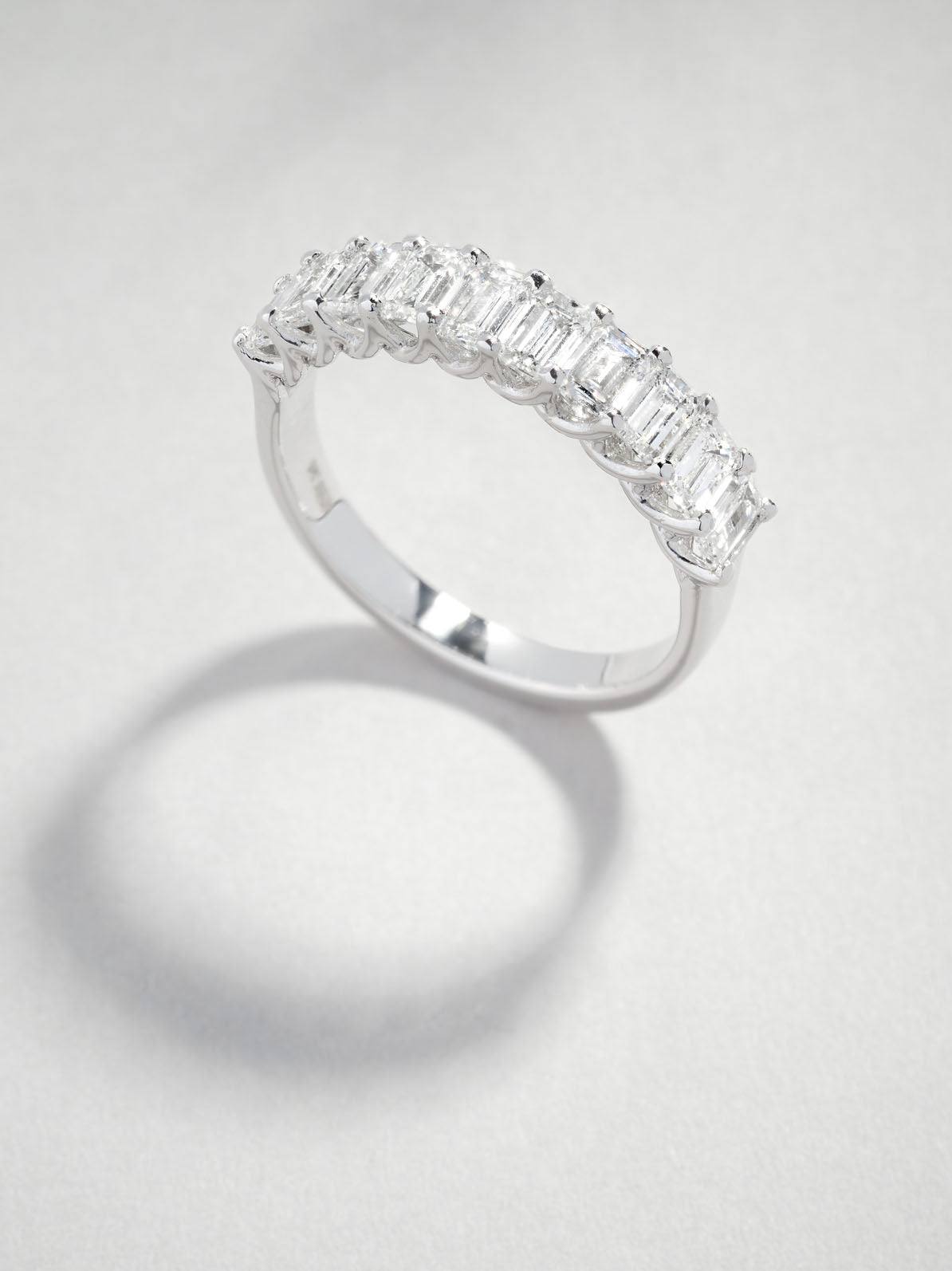 Perspective view of a comfort fit 1.4ct emerald cut band for diamond engagement rings sets.