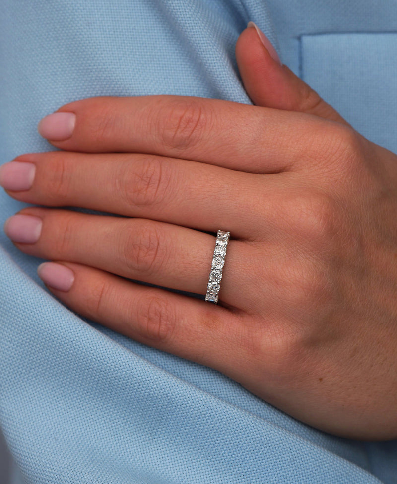A luxurious cushion cut diamond eternity ring from our premium diamond engagement band collection.