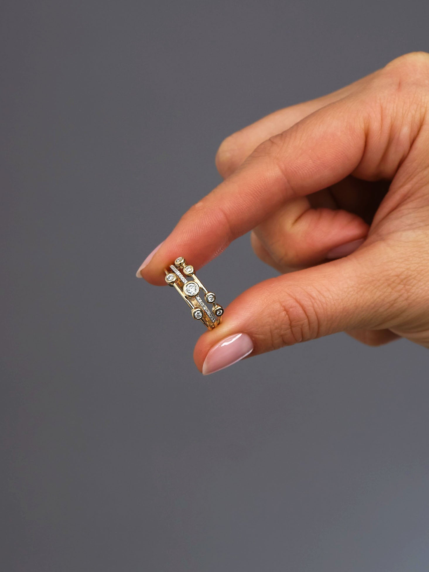 Perspective view of a high-quality 0.33ct mini bubble ring, perfect for stacking with other diamond rings for women.