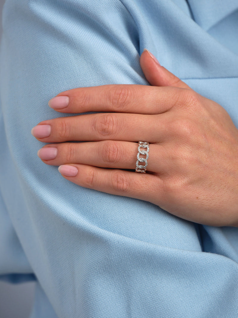 Curb chain diamond ring worn on a finger, showcasing a bold and contemporary diamond rings for women design.