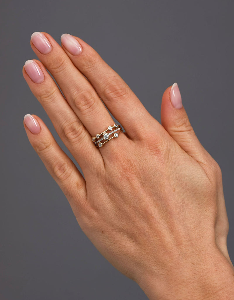 0.33ct mini bubble diamond band worn on a finger, showcasing a trendy diamond rings for women design.
