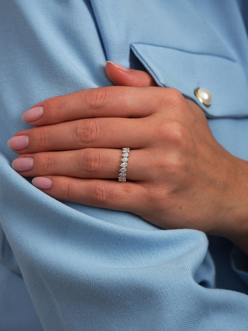 Perspective view of a high-quality slanted pear diamond ring, perfect for stacking with other diamond rings for women.