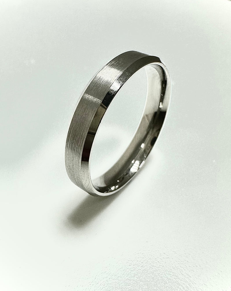 A contemporary 4mm bevelled edge matt finish ring from our premium diamond wedding bands collection.