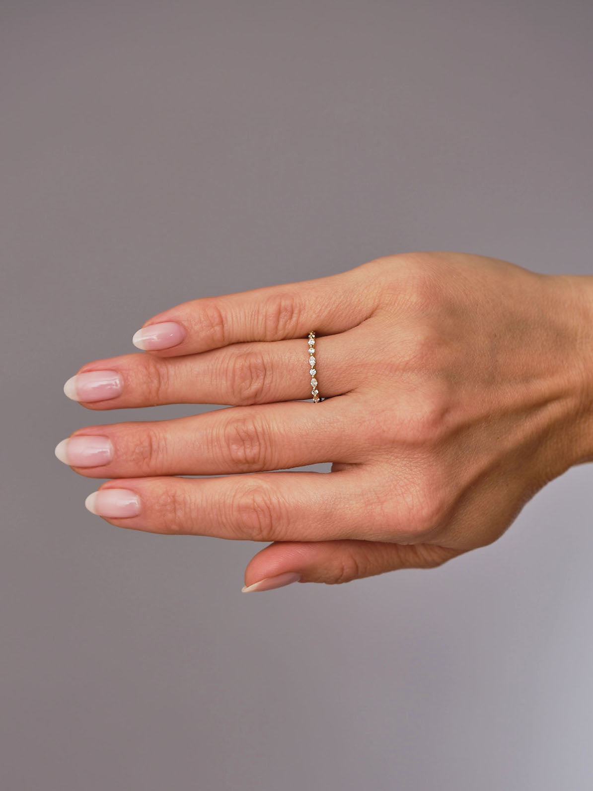 A marquise and round diamond eternity band from our diamond wedding bands collection.