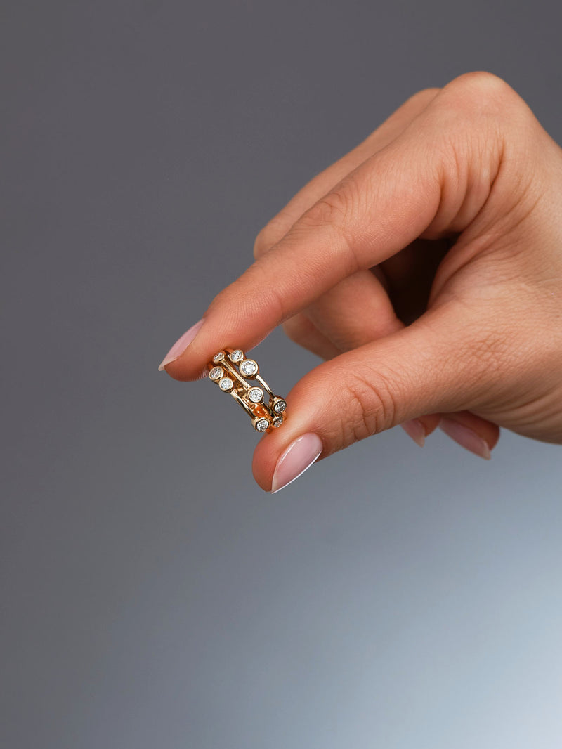 Perspective view of a high-quality 0.70ct midi bubble ring, perfect for stacking with other diamond wedding bands.