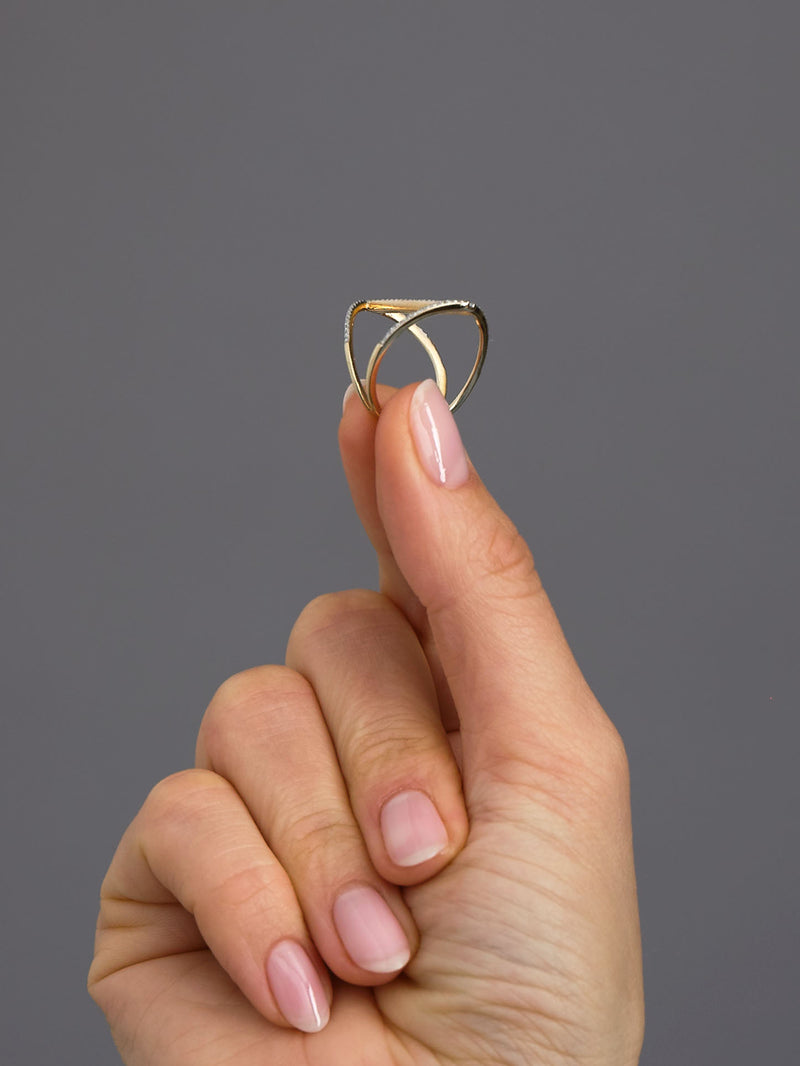 A-line diamond band worn on a finger, showcasing a sleek and stylish engagement bands for her layout.