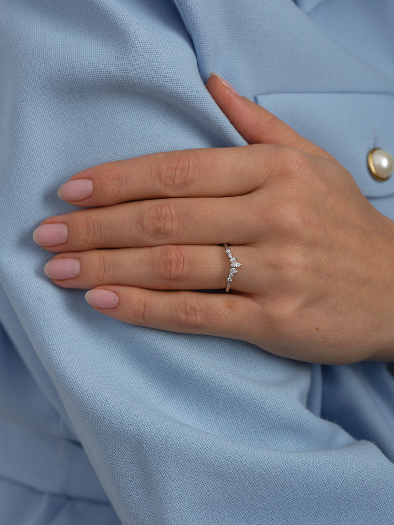 Close-up detail of the brilliant diamonds on this fancy wishbone style diamond engagement band.