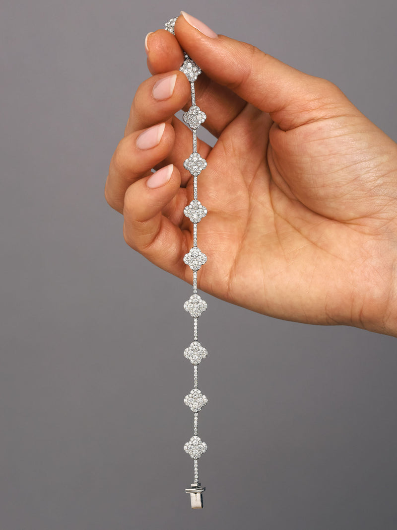 Diamond Clover Bracelet on wrist, 18kt white gold 3.90ct of brilliant diamonds in clover design, handcrafted luxury jewellery by Layla Diamonds London lab grown or natural mined diamonds on hand , wrist, arm