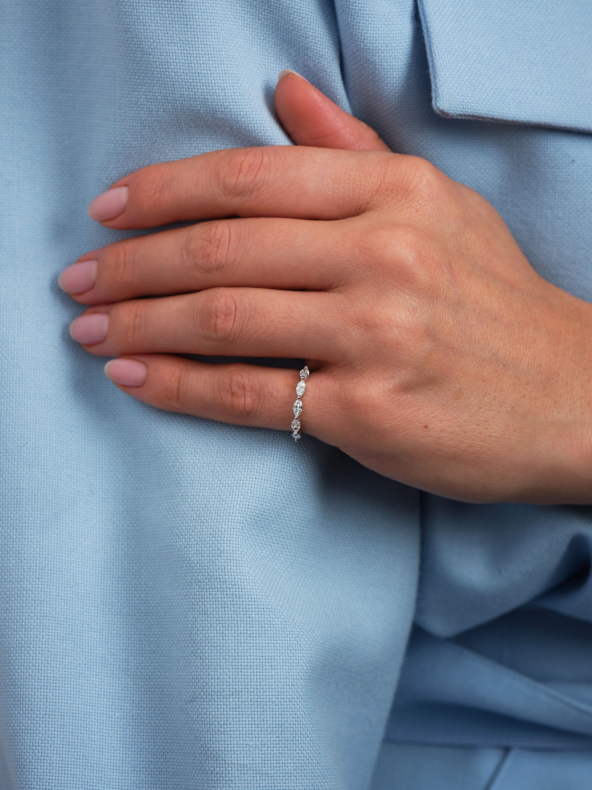 Perspective view of marquise diamond engagement bands, perfect for pairing with an engagement ring.