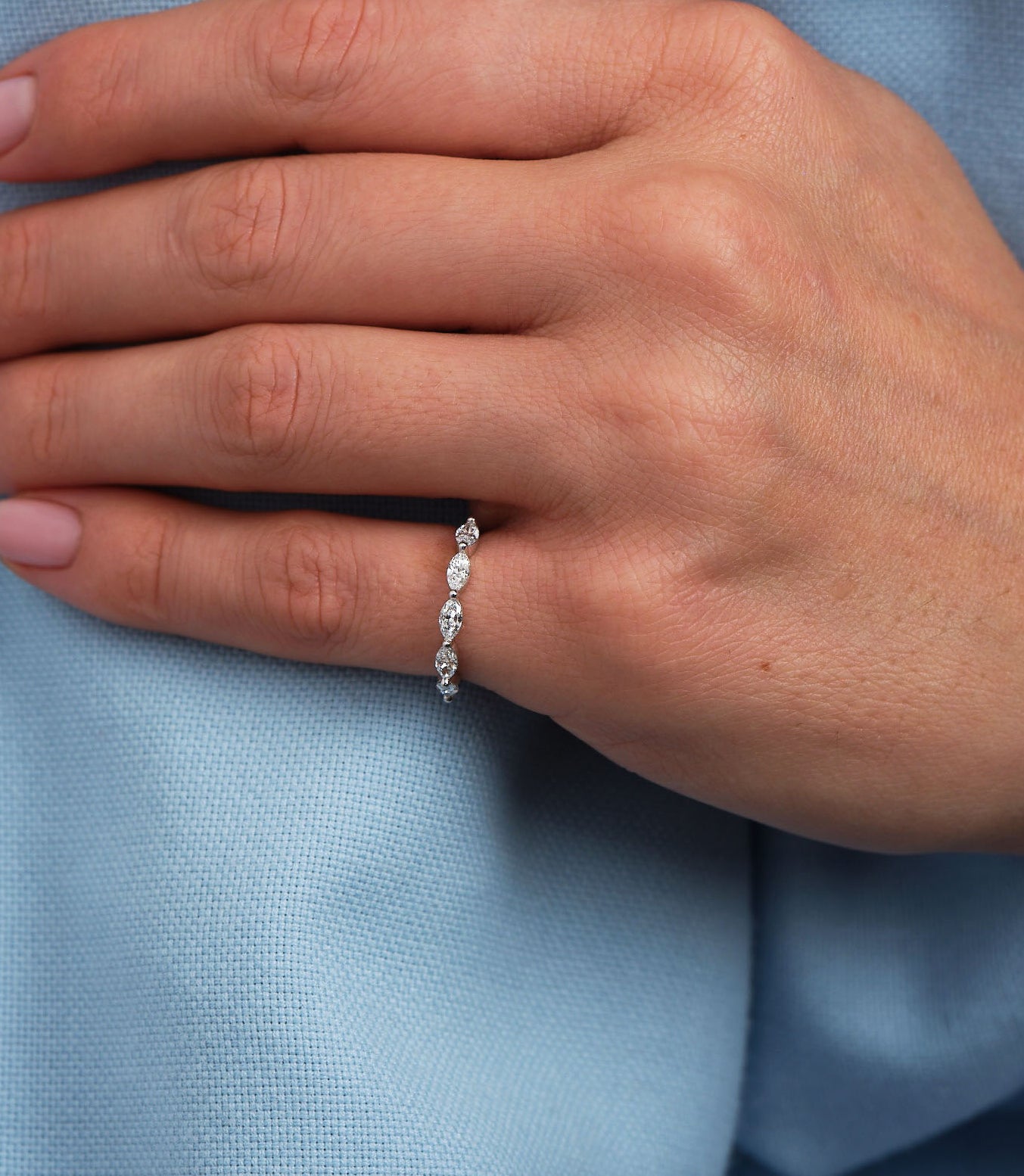 A stunning marquise diamond engagement bands design featuring a full eternity setting.