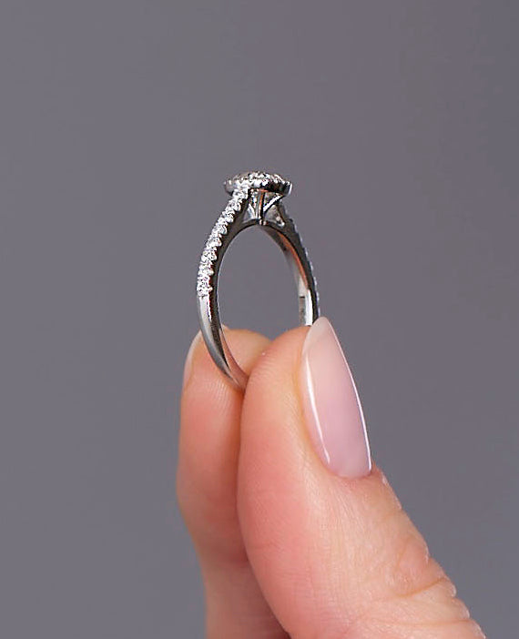 Side view of a cushion cut diamond ring, part of our marquise engagement ring diamond range.